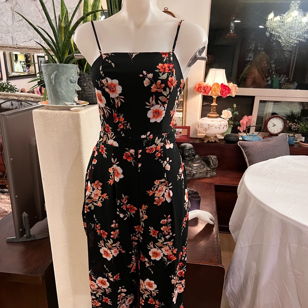 Tie back floral jumpsuit; 100% polyester; excellent condition; size s;